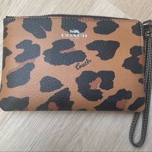 A cheetah print coach wristlet